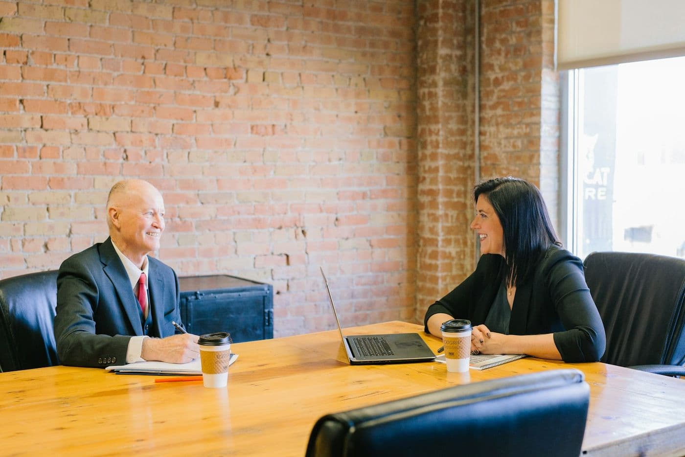 A Necomitt tax advisor meeting with a client